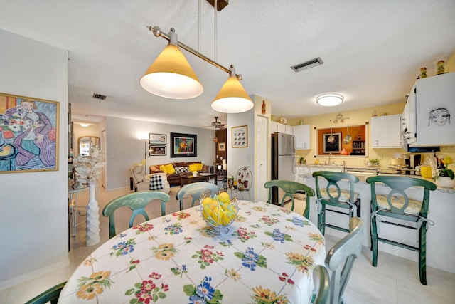 9152 Affirmed Ln, Boca Raton, FL 33496 - dining area with ceiling fan and light tile patterned flooring