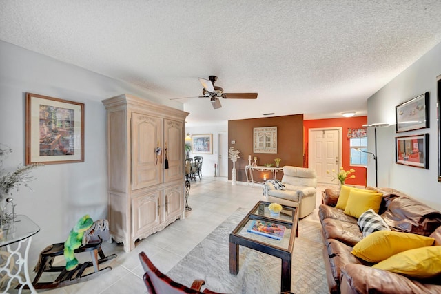 9152 Affirmed Ln, Boca Raton, FL 33496 - living area featuring a ceiling fan, light tile patterned floors, and a textured ceiling