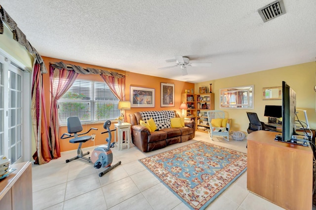 9152 Affirmed Ln, Boca Raton, FL 33496 - tiled home office with plenty of natural light, a ceiling fan, and a textured ceiling