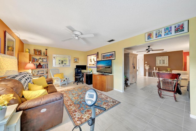 9152 Affirmed Ln, Boca Raton, FL 33496 - living area with ceiling fan, an office area, light tile patterned flooring, a textured ceiling, and baseboards