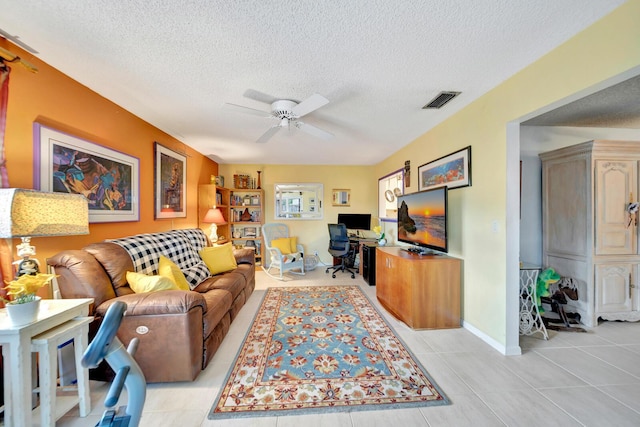 9152 Affirmed Ln, Boca Raton, FL 33496 - living room with a desk, a textured ceiling, a ceiling fan, light tile patterned flooring, and baseboards