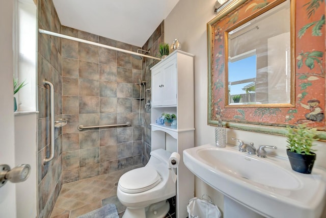 9152 Affirmed Ln, Boca Raton, FL 33496 - bathroom featuring a tile shower, toilet, and a sink