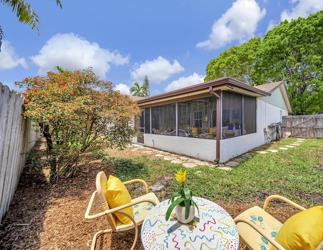 9152 Affirmed Ln, Boca Raton, FL 33496 - rear view of house featuring a sunroom and a fenced backyard