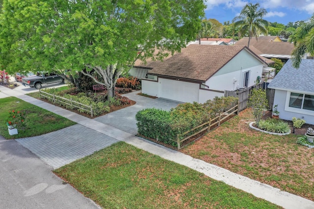 9152 Affirmed Ln, Boca Raton, FL 33496 - view of front of home with driveway, fence, an attached garage, and stucco siding