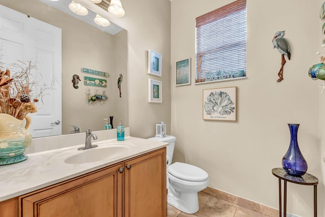 2478 SW Liberty St, Palm City, FL 34990 - bathroom with tile patterned flooring, toilet, and vanity