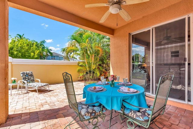 2478 SW Liberty St, Palm City, FL 34990 - view of patio with a ceiling fan, outdoor dining area, and fence