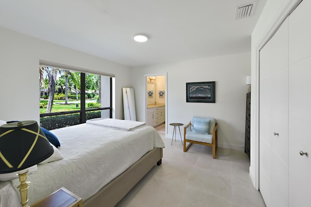 4054 SW Gleneagle Cir, Palm City, FL 34990 - bedroom with a closet, baseboards, and ensuite bathroom