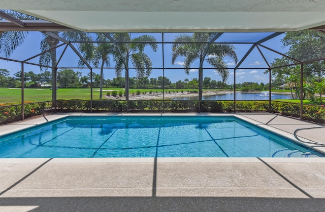 4054 SW Gleneagle Cir, Palm City, FL 34990 - swimming pool featuring a water view, glass enclosure, and a patio