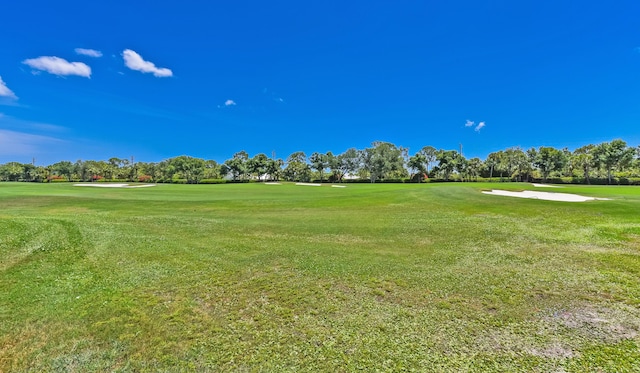 4054 SW Gleneagle Cir, Palm City, FL 34990 - surrounding community with view of golf course, a lawn, and view of scattered trees