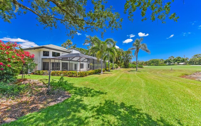 4054 SW Gleneagle Cir, Palm City, FL 34990 - view of grassy yard with glass enclosure