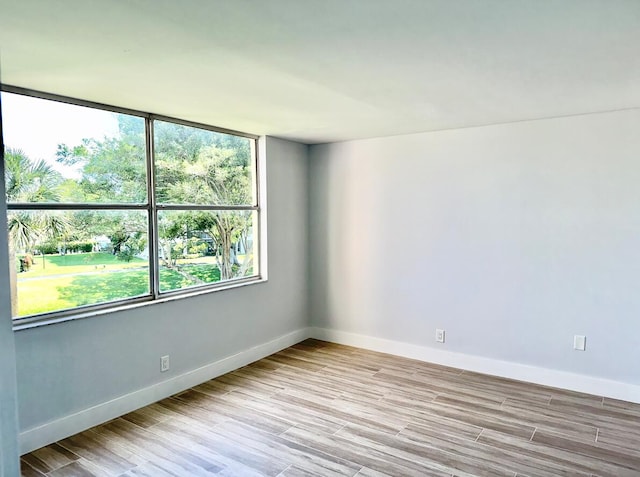 14527 Bonaire Blvd Unit 306, Delray Beach, FL 33446 - unfurnished room featuring baseboards and wood finished floors