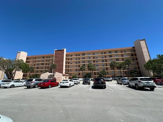 14527 Bonaire Blvd Unit 306, Delray Beach, FL 33446 - view of apartment building / complex with uncovered parking