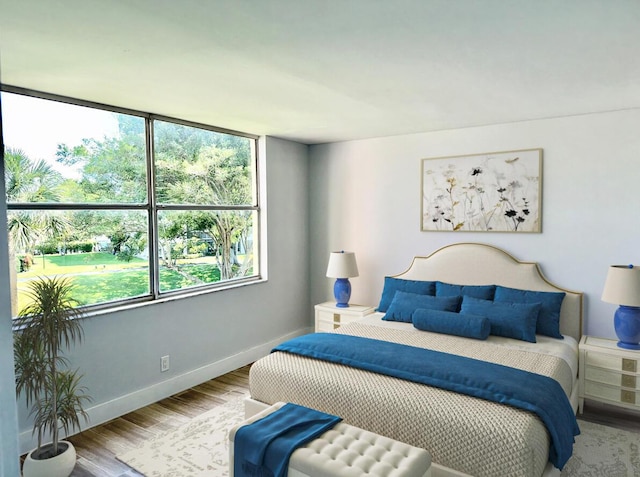 14527 Bonaire Blvd Unit 306, Delray Beach, FL 33446 - bedroom featuring wood finished floors and baseboards