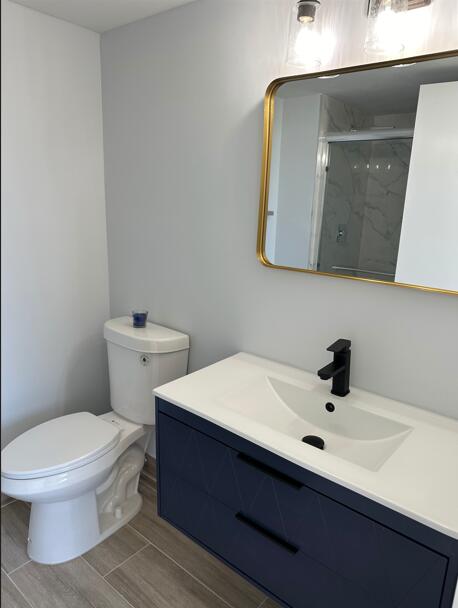 14527 Bonaire Blvd Unit 306, Delray Beach, FL 33446 - full bathroom with vanity, a marble finish shower, and toilet