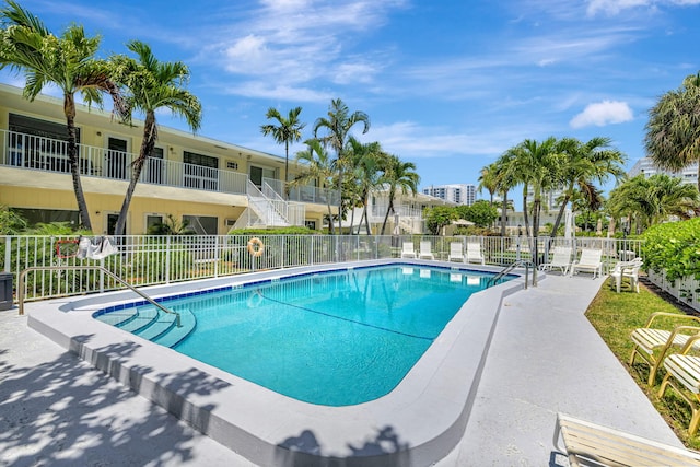 community pool featuring fence