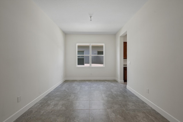 4641 Woodland Way, Westlake, FL 33470 - spare room with baseboards and tile patterned flooring