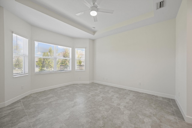 4641 Woodland Way, Westlake, FL 33470 - empty room with a ceiling fan, baseboards, and a raised ceiling