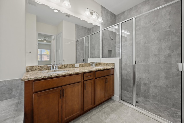 4641 Woodland Way, Westlake, FL 33470 - bathroom with a stall shower, tile patterned flooring, and double vanity