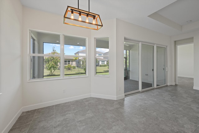 4641 Woodland Way, Westlake, FL 33470 - spare room with baseboards and a chandelier