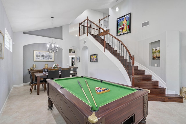 12341 NW 78th Mnr, Parkland, FL 33076 - rec room with arched walkways, high vaulted ceiling, light tile patterned floors, a chandelier, and baseboards