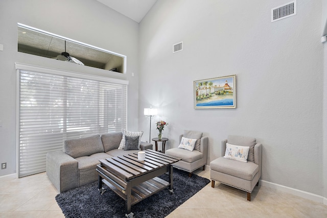 12341 NW 78th Mnr, Parkland, FL 33076 - living room featuring light tile patterned floors, a high ceiling, and baseboards