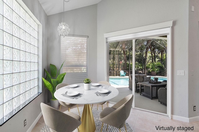 12341 NW 78th Mnr, Parkland, FL 33076 - dining area featuring light tile patterned flooring, baseboards, and a chandelier