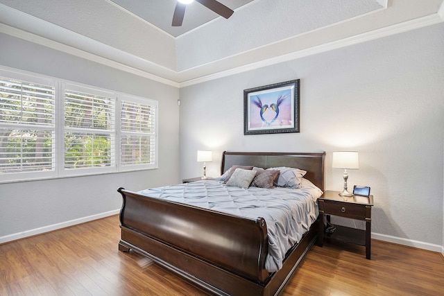 12341 NW 78th Mnr, Parkland, FL 33076 - bedroom featuring wood finished floors, baseboards, ornamental molding, a raised ceiling, and a ceiling fan