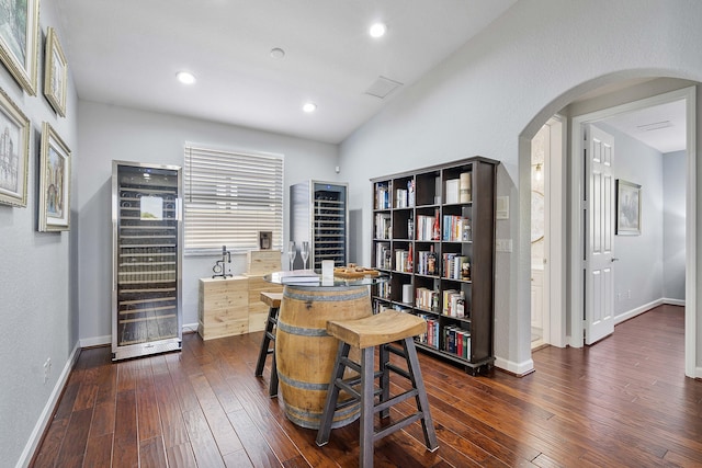 12341 NW 78th Mnr, Parkland, FL 33076 - office area featuring arched walkways, dark wood finished floors, baseboards, a heating unit, and recessed lighting