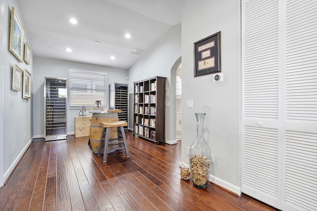 12341 NW 78th Mnr, Parkland, FL 33076 - office area with arched walkways, dark wood-style flooring, baseboards, lofted ceiling, and wine cooler