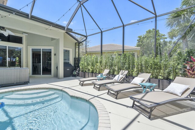 12341 NW 78th Mnr, Parkland, FL 33076 - outdoor pool with a patio and a lanai