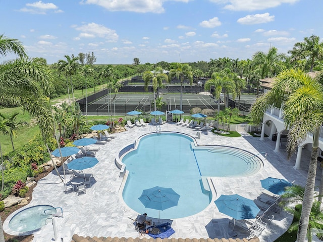 12341 NW 78th Mnr, Parkland, FL 33076 - community pool featuring a patio and view of wooded area