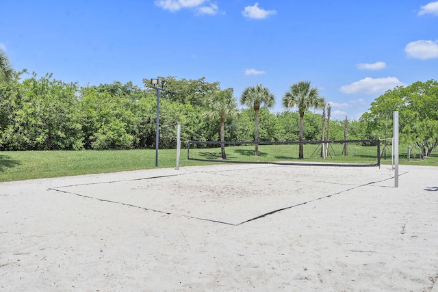 12341 NW 78th Mnr, Parkland, FL 33076 - view of community featuring volleyball court, a lawn, and view of wooded area