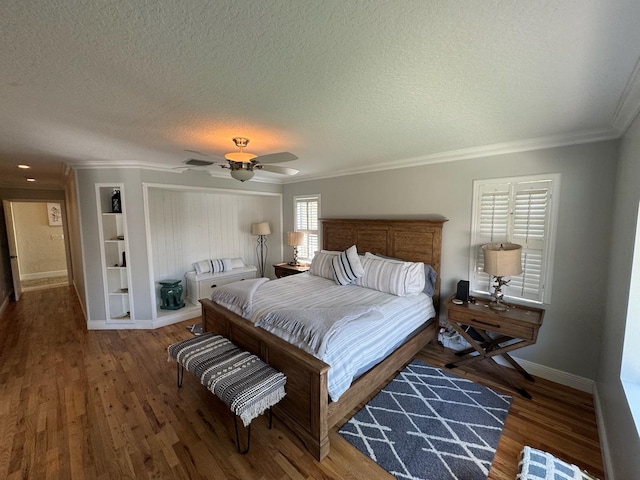 14324 Paddock Dr, Wellington, FL 33414 - bedroom with a textured ceiling, baseboards, ornamental molding, wood finished floors, and ceiling fan