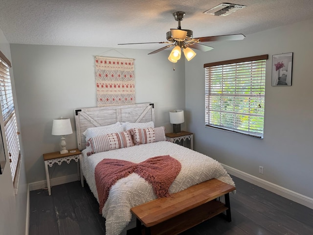 14324 Paddock Dr, Wellington, FL 33414 - bedroom featuring baseboards, multiple windows, wood-type flooring, and a textured ceiling