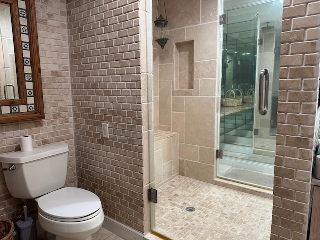 14324 Paddock Dr, Wellington, FL 33414 - full bath with a stall shower, toilet, tile patterned flooring, and brick wall