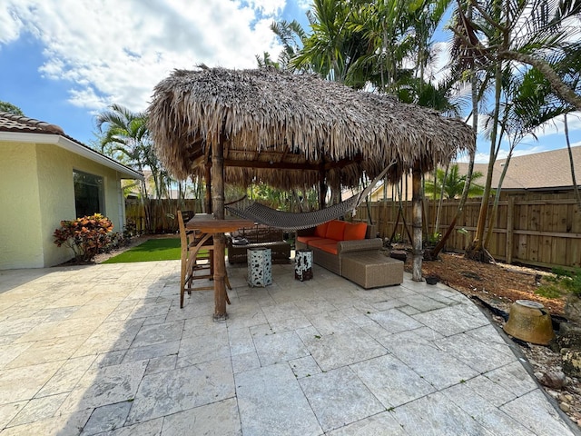 14324 Paddock Dr, Wellington, FL 33414 - view of patio / terrace with a fenced backyard, an outdoor hangout area, a gazebo, and outdoor dining area