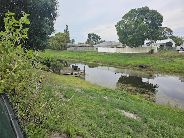 389 SE Whitmore Dr, Port Saint Lucie, FL 34984 - water view featuring a dock