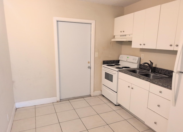 4061 N Dixie Hwy Unit 3, Oakland Park, FL 33334 - kitchen with white appliances, under cabinet range hood, a sink, dark countertops, and baseboards