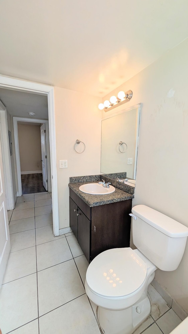 4061 N Dixie Hwy Unit 3, Oakland Park, FL 33334 - half bath with toilet, vanity, tile patterned floors, and baseboards