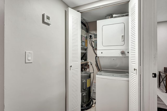 10001 W Atlantic Blvd Unit 319, Coral Springs, FL 33071 - laundry room with stacked washer and clothes dryer