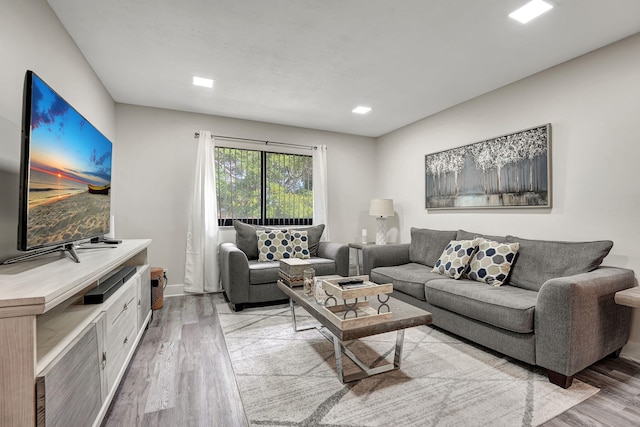 10001 W Atlantic Blvd Unit 319, Coral Springs, FL 33071 - living room featuring light wood-style floors and baseboards