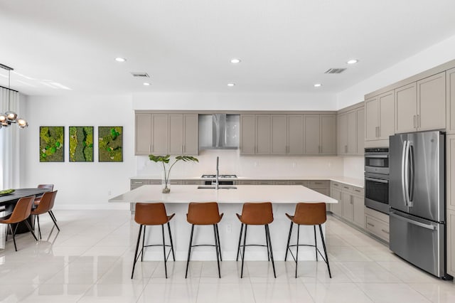 8294 Fishhawk Falls Ct, Boca Raton, FL 33496 - kitchen featuring appliances with stainless steel finishes, gray cabinets, wall chimney exhaust hood, light countertops, and a breakfast bar area