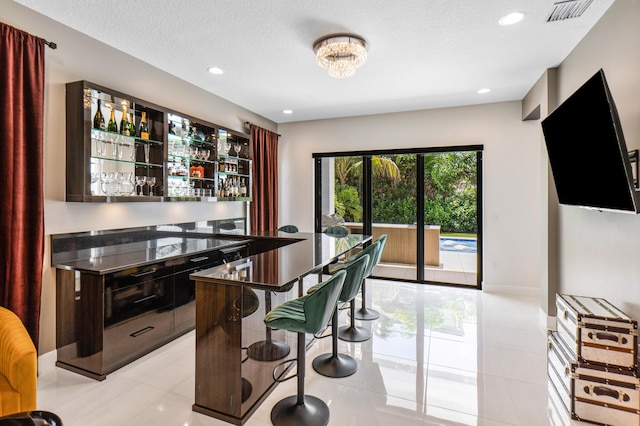 8294 Fishhawk Falls Ct, Boca Raton, FL 33496 - indoor dry bar with recessed lighting and light tile patterned floors