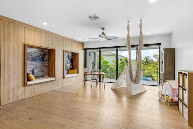 8294 Fishhawk Falls Ct, Boca Raton, FL 33496 - playroom with ceiling fan, light wood-style flooring, wood walls, and recessed lighting