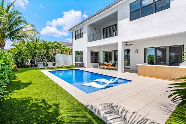 8294 Fishhawk Falls Ct, Boca Raton, FL 33496 - rear view of property featuring a balcony, stucco siding, a patio area, and a ceiling fan
