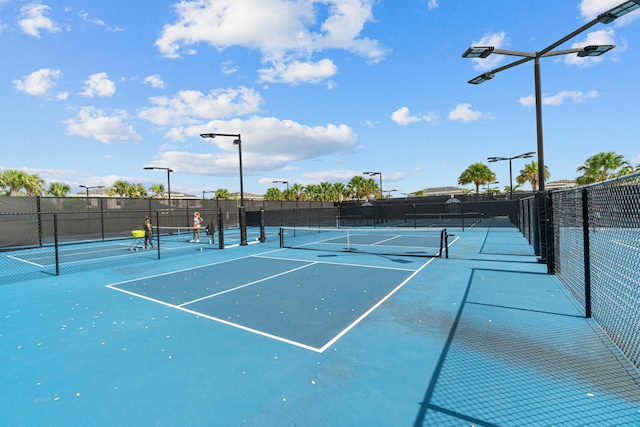 8294 Fishhawk Falls Ct, Boca Raton, FL 33496 - view of tennis court featuring fence