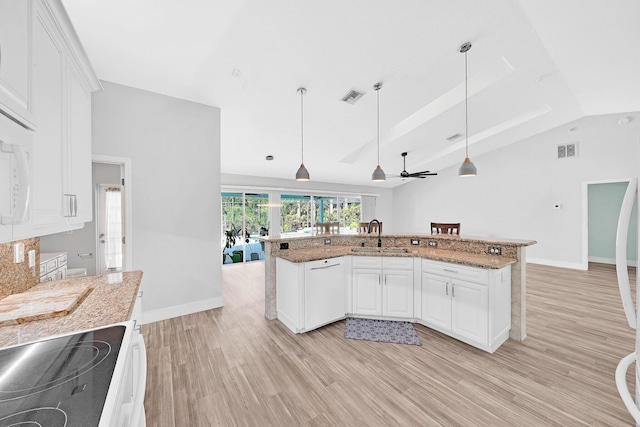 139 NE Royce Ave, Port Saint Lucie, FL 34983 - kitchen with range with electric stovetop, a sink, light wood-style floors, light stone countertops, and lofted ceiling