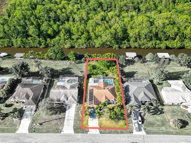 139 NE Royce Ave, Port Saint Lucie, FL 34983 - aerial perspective of suburban area with property parcel outlined and a nearby body of water