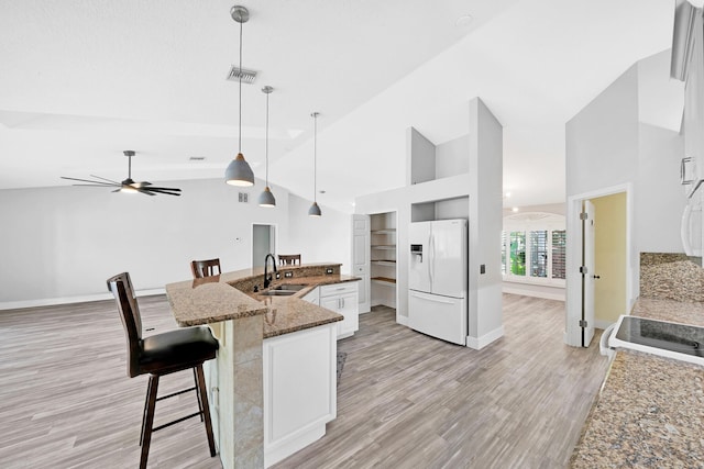 139 NE Royce Ave, Port Saint Lucie, FL 34983 - kitchen featuring white appliances, a sink, a ceiling fan, light wood-type flooring, and baseboards