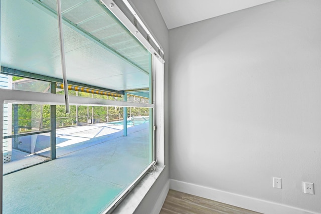 139 NE Royce Ave, Port Saint Lucie, FL 34983 - unfurnished room with baseboards and wood finished floors